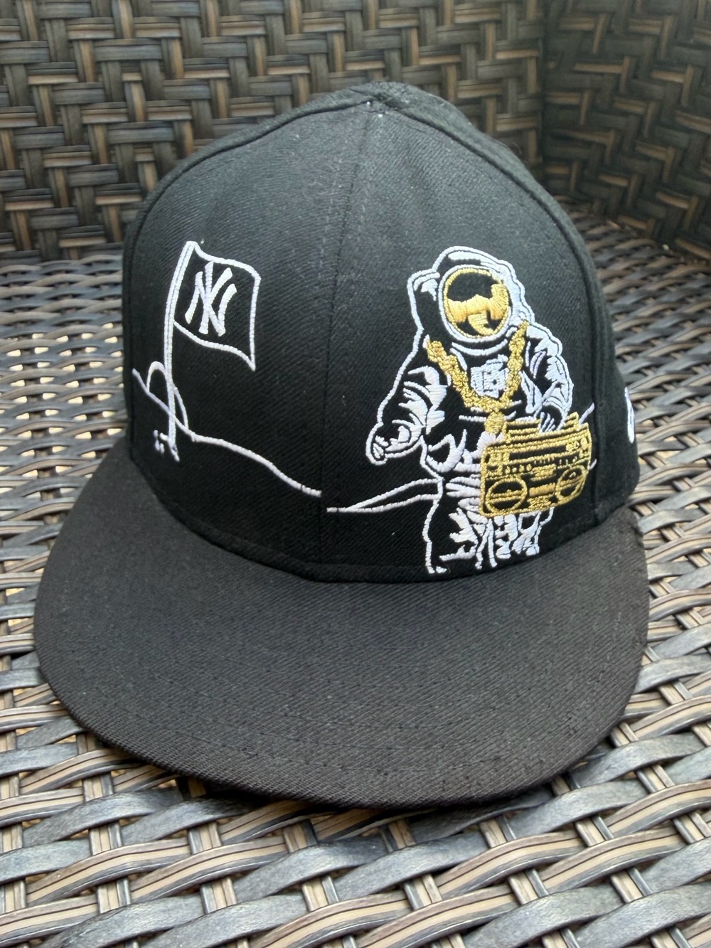 New Era Yankees Black Fitted Hat with Gold Astronaut Embroidery